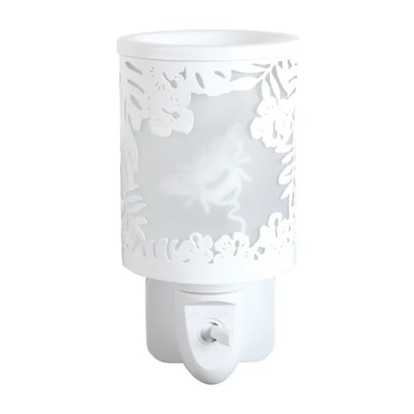White plug in wax melt burner unlit, showing the floral cut-out frame and bumblebee design on the frosted panel.