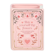 Front view of pink Buy Yourself the Flowers book shaped vase