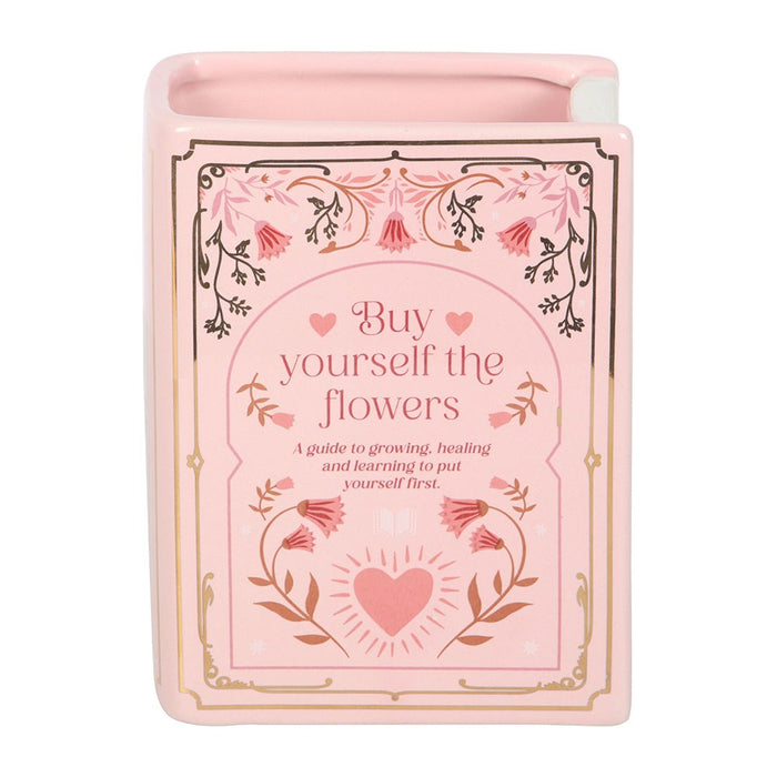 Front view of pink Buy Yourself the Flowers book shaped vase