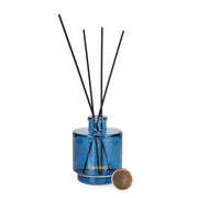 Candlelight Paradise Flower & Mango 200ml reed diffuser, blue glass bottle with black reeds and gold detail.