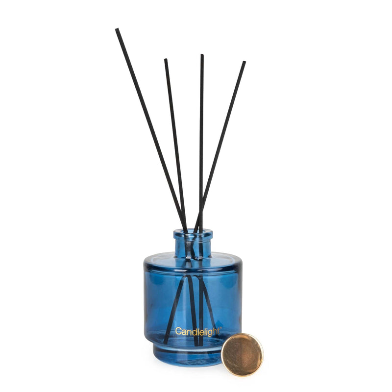 Candlelight Paradise Flower & Mango 200ml reed diffuser, blue glass bottle with black reeds and gold detail.