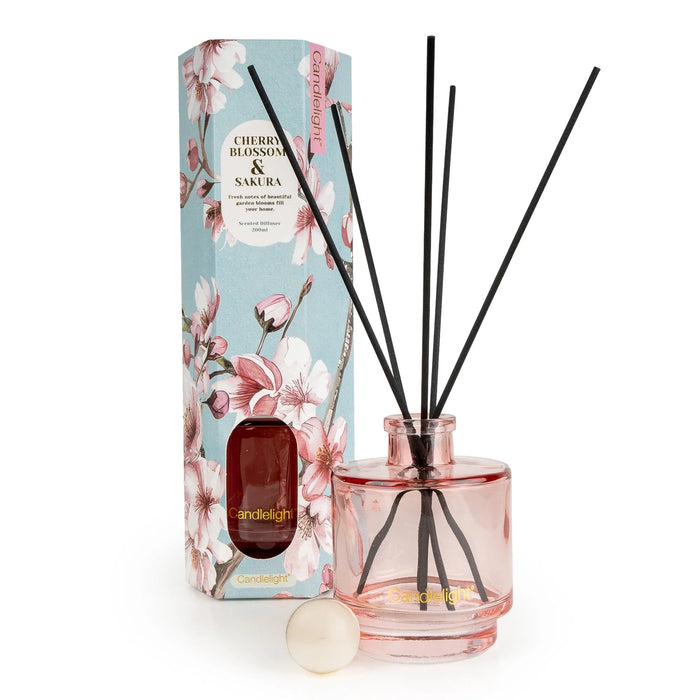Candlelight Cherry Blossom & Sakura 200ml reed diffuser with pink glass bottle, black reeds and matching blossom gift box.