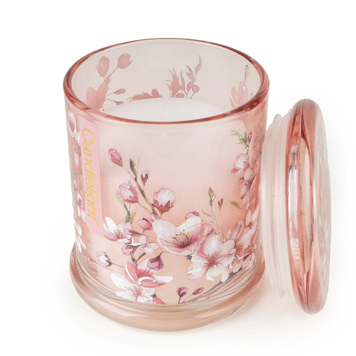 Candlelight Cherry Blossom & Sakura jar candle shown open with lid beside, blush pink floral glass and white wax.