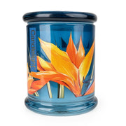Candlelight Paradise Flower & Mango large glass lidded jar candle, teal blue jar with orange tropical flower artwork, front view.