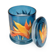 Candlelight Paradise Flower & Mango jar candle shown open with lid beside, blue glass with tropical flower print and white wax.
