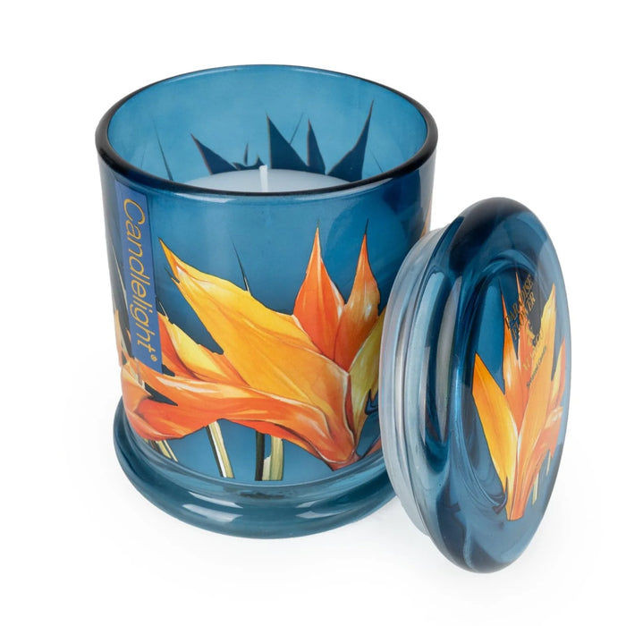 Candlelight Paradise Flower & Mango jar candle shown open with lid beside, blue glass with tropical flower print and white wax.