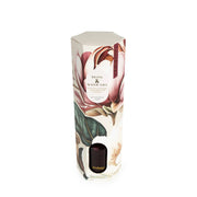 Angled view of Candlelight Peony & Water Lily reed diffuser gift box with botanical design and product window.