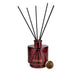 Candlelight Peony & Water Lily reed diffuser set showing boxed packaging, burgundy bottle, black reeds and gold cap.