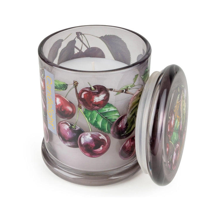 Candlelight Sour Cherry & Lime jar candle shown open with lid beside, cherry design around the glass and white wax inside.