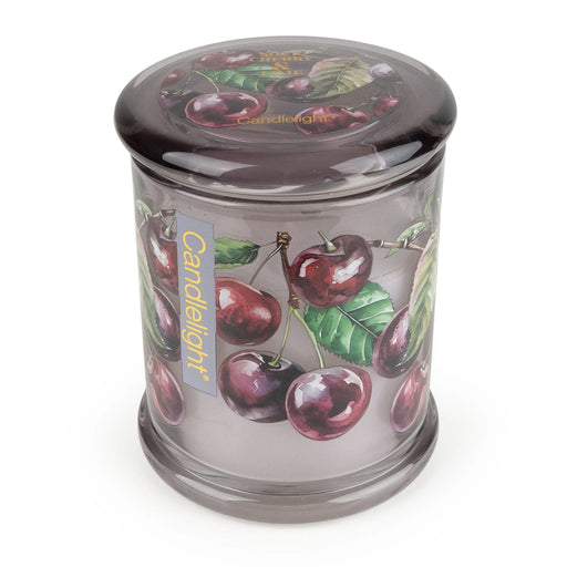 Top view of Candlelight Sour Cherry & Lime large glass jar candle with matching lid featuring cherry artwork.