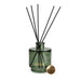 Candlelight White Poppy & Sage 200ml reed diffuser in smoky green glass with black reeds and gold logo, on white background.
