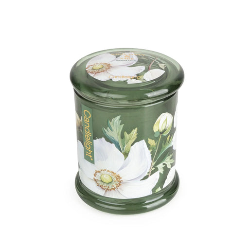 Angled view of Candlelight White Poppy & Sage large glass lidded jar candle in deep green glass with white poppy and leaf print.