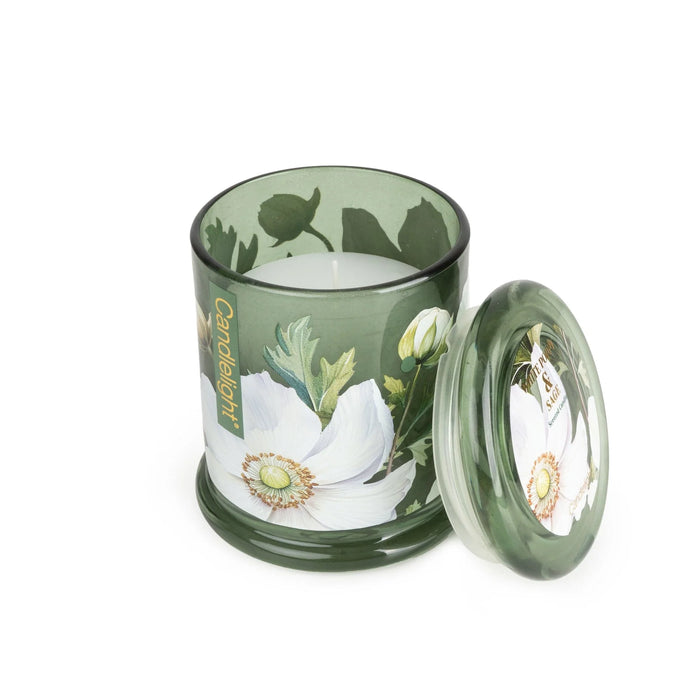 Candlelight White Poppy & Sage large glass lidded jar candle shown open, green glass with white poppy floral design and lid beside.