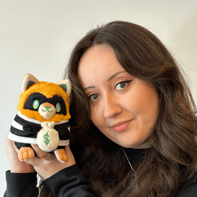 Person holding Squishable Alter Egos Cat Burglar Kitty plush toy