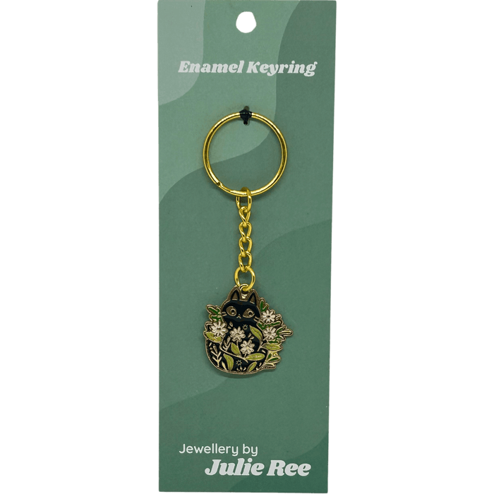 Enamel keyring with black cat peeking through white flowers and green leaves – Jewellery By Julie Ree