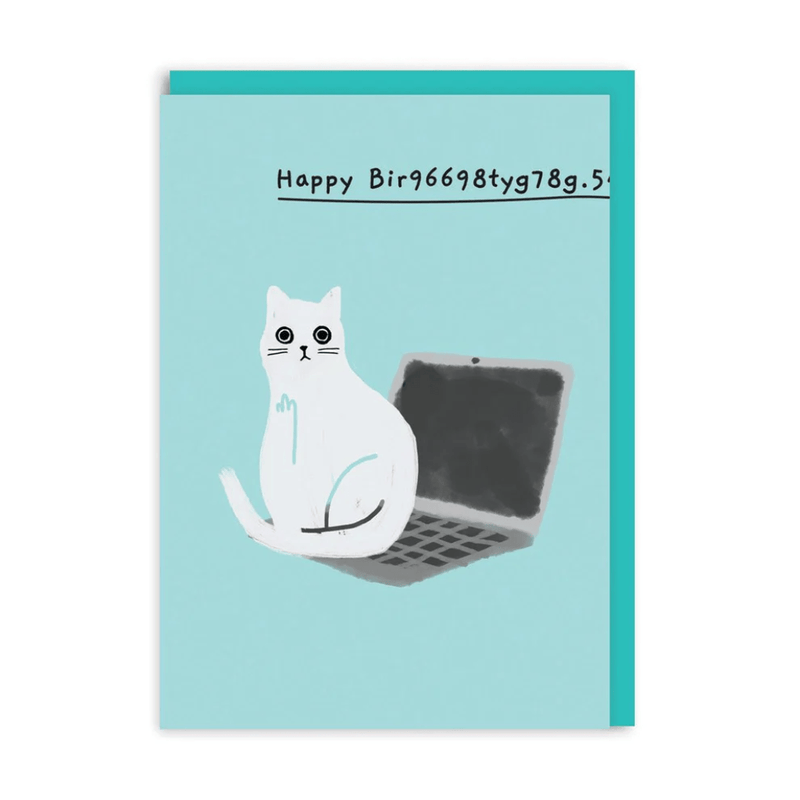 Funny birthday greeting card with white cat sitting on laptop, garbled “Happy Birthday” text on teal background

