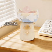 Fly to Freedom Cat PAI blind box figure displayed beside a keyboard