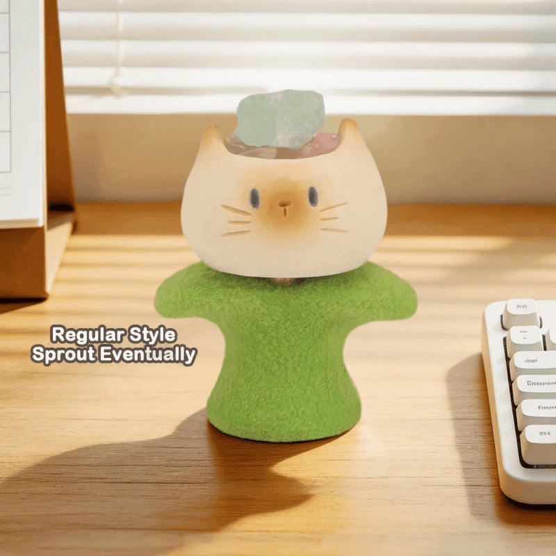 Sprout Eventually Cat PAI blind box figure on a green base beside a keyboard