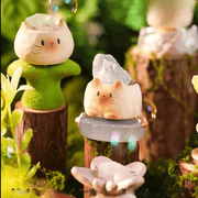 Sprout Eventually and Starry Sea Cat PAI figures in a crystal-themed forest display