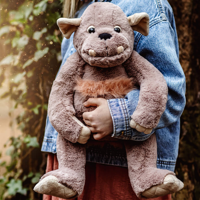 Charlie Bears Bearhouse Boulder plush soft toy being held outdoors