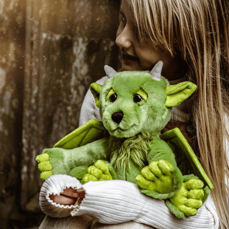 Charlie Bears Bearhouse Spires green dragon plush soft toy being hugged