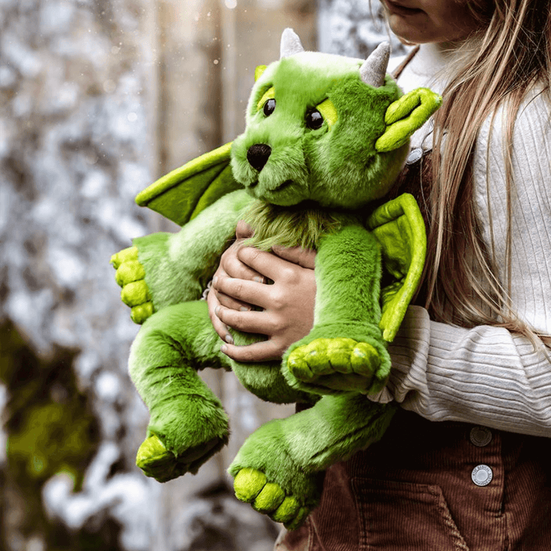 Charlie Bears Bearhouse Spires green plush dragon soft toy being held outdoors