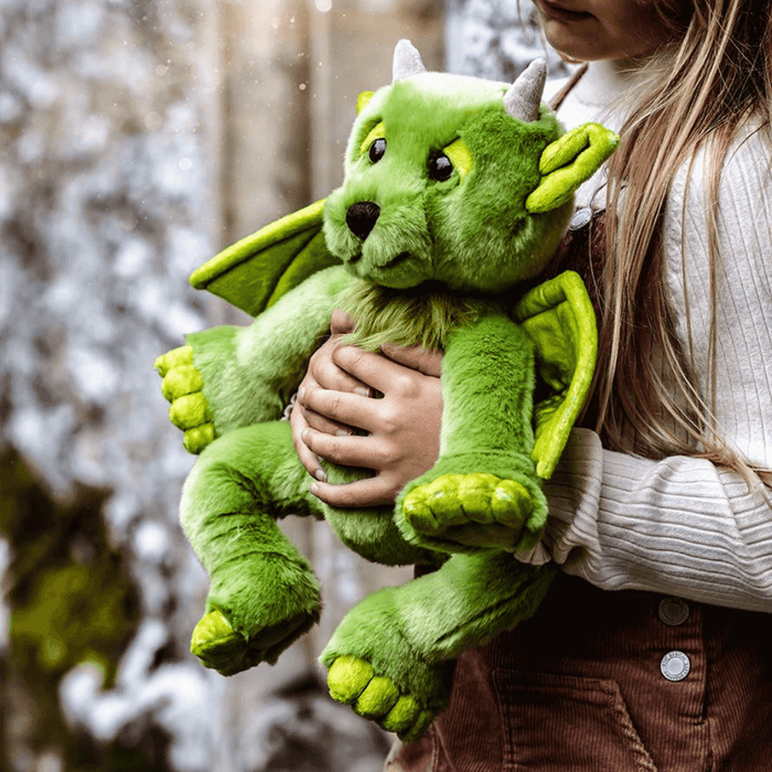 Charlie Bears Bearhouse Spires green plush dragon soft toy being held outdoors