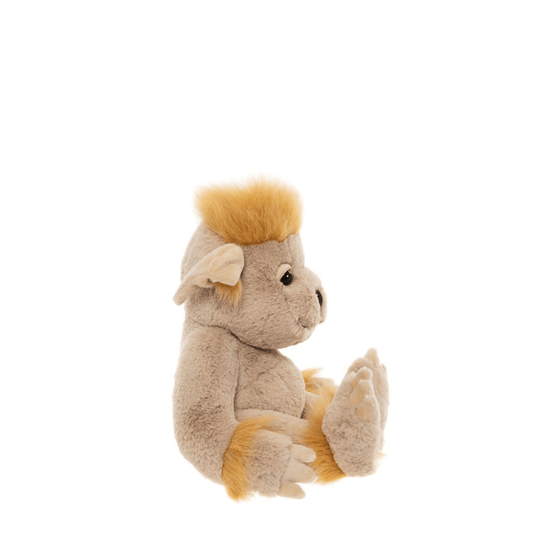 Side profile of Charlie Bears Bedrock beige ogre plush
