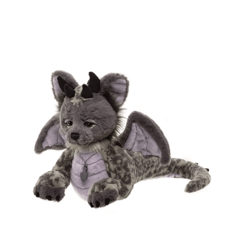 Side view of Charlie Bears Eragon showing his long patterned tail, feline features, wings and plush body