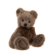 Charlie Bears Oak plush teddy bear with dark brown paw pads and organza bow, angled sitting pose