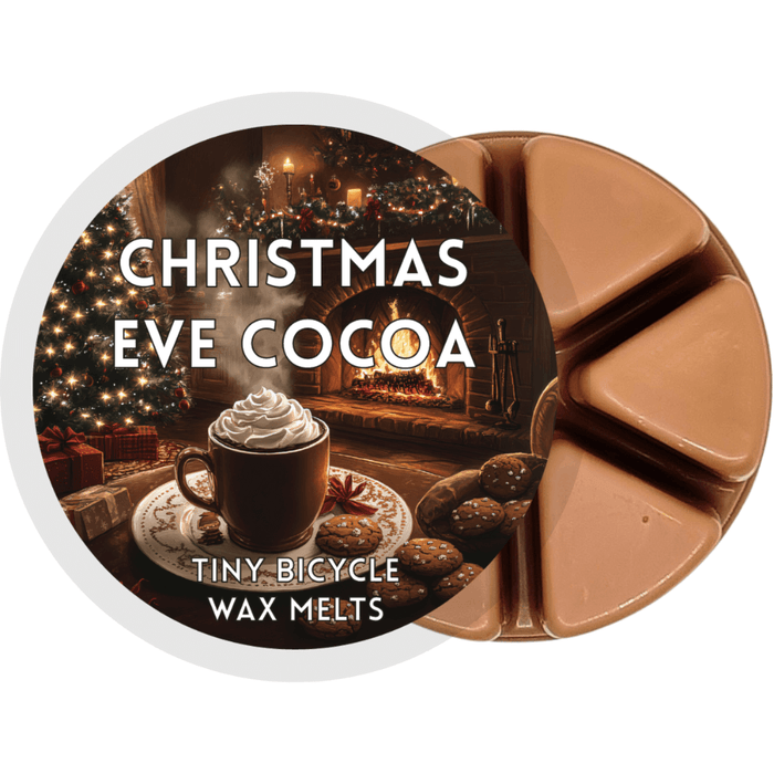 Christmas Eve Cocoa brown segmented wax melt pot with mug of hot chocolate by a fireplace and Christmas tree