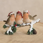 Christmas robin log ornament displayed on a tabletop

