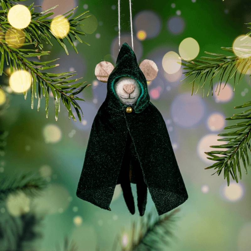 Cloaked mouse felt decoration hanging from a Christmas tree