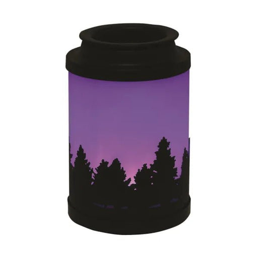 Cloudy Melter Forest wax melt burner lit with purple LED and pine tree silhouette

