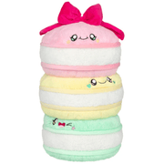 Front view of the Comfort Food Macarons plush toy with embroidered faces and pink bow