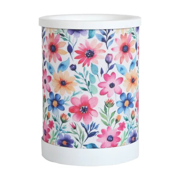 Daisy floral electric wax melt burner with a colourful pink, blue and purple flower design and white top and base.