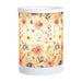 Daisy floral electric wax melt burner switched on, glowing warmly through the floral patterned wrap.