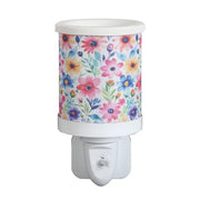 Daisy floral plug in wax melt burner with a colourful flower pattern and an on/off switch on the plug base.