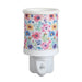 Daisy floral plug in wax melt burner with a colourful flower pattern and an on/off switch on the plug base.