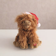 Fluffy Highland cow toy with press button, Jingle Bell Rock feature

