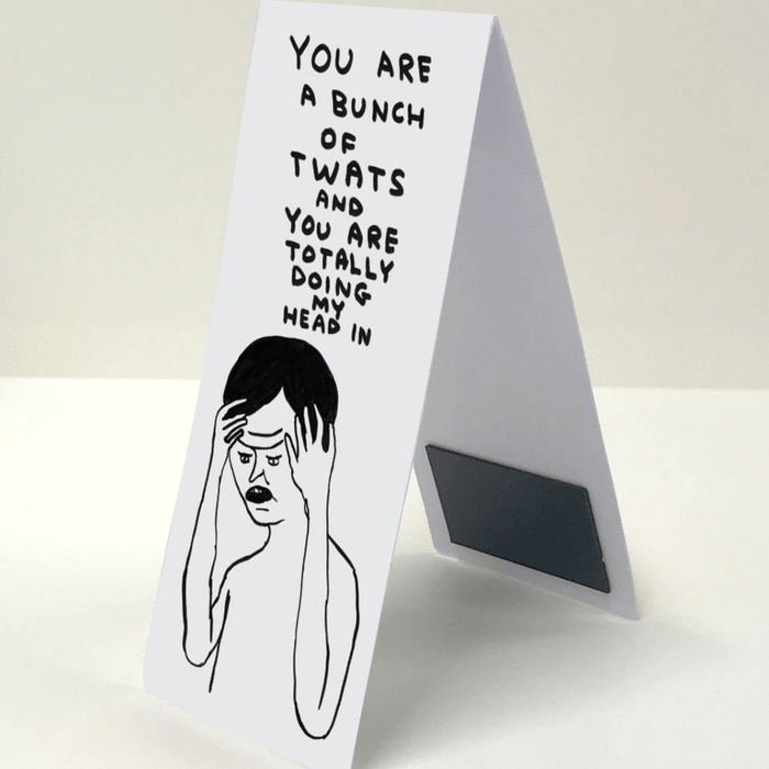 Side view of folded magnetic bookmark; hidden magnet visible and Shrigley illustration on front.
