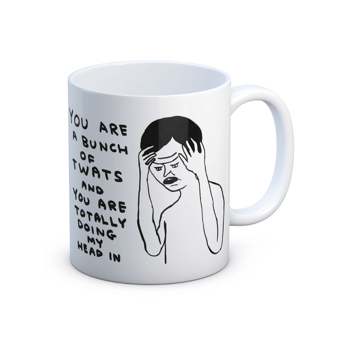 Studio shot of white stoneware mug featuring frustrated figure and text “You’re a bunch of twats…”.

