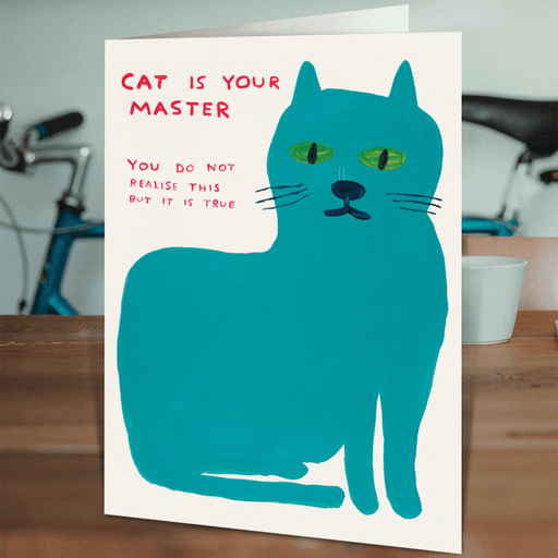 David Shrigley Cat Is Your Master greeting card displayed on a table