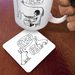David Shrigley Live in Harmony rabbit coaster shown in use under a mug on a wooden table