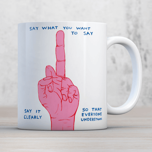 David Shrigley Say What You Want mug shown in a lifestyle setting with pink hand illustration