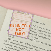 Definitely Not Smut magnetic bookmark clipped over a book page