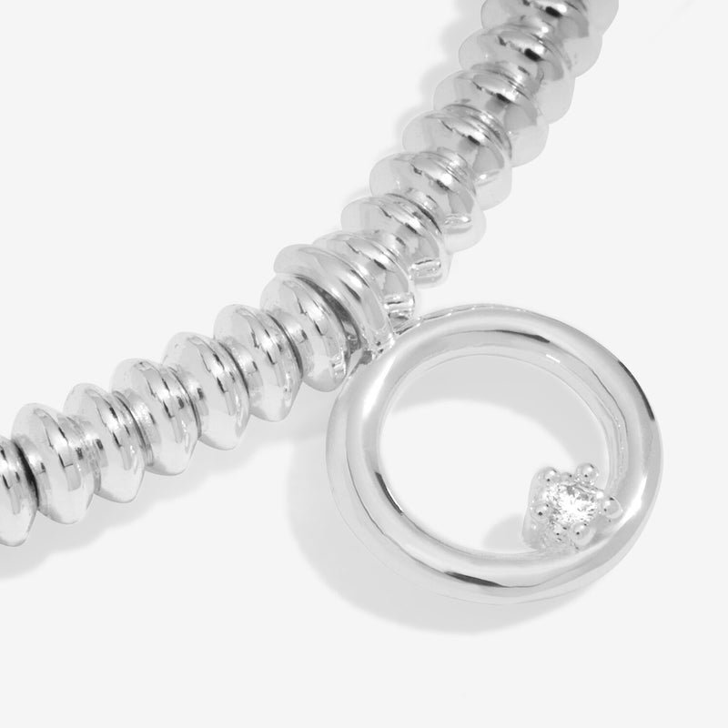 “Macro detail of lab‑grown diamond set in open circle charm”
