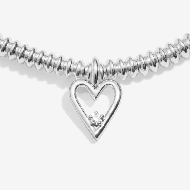 Close‑up of lab‑grown diamond set inside pointed heart charm