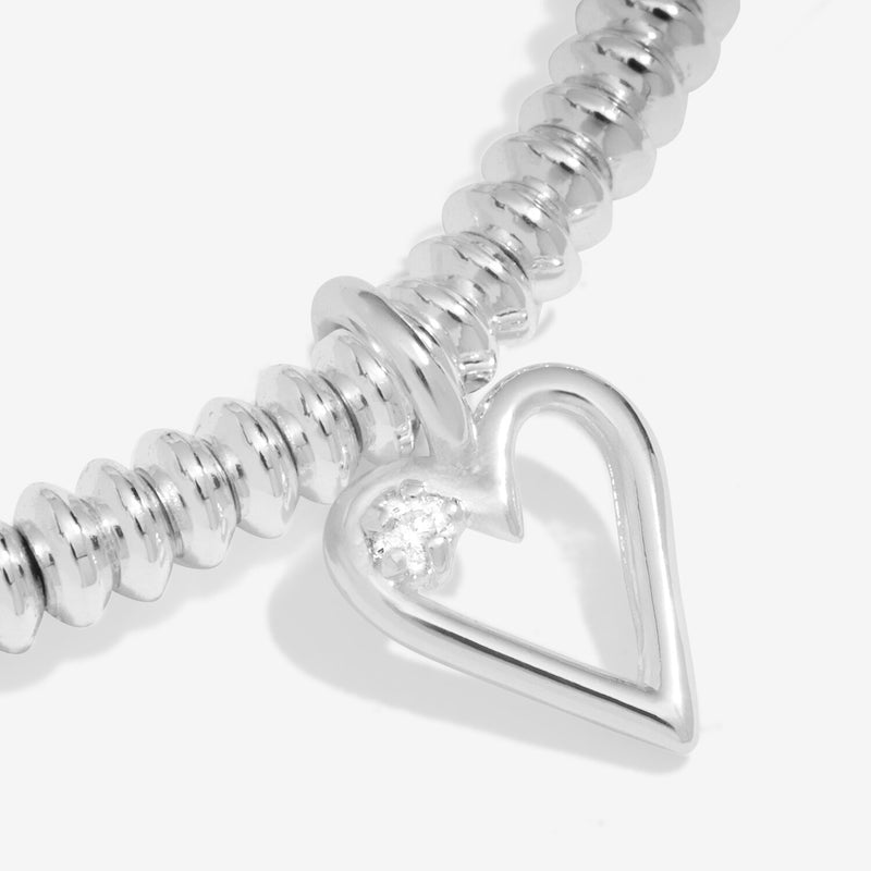 Macro view highlighting lab‑grown diamond in heart charm
