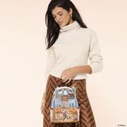Model carrying Loungefly Disney 101 Dalmatians Roger and Anita Mini Backpack